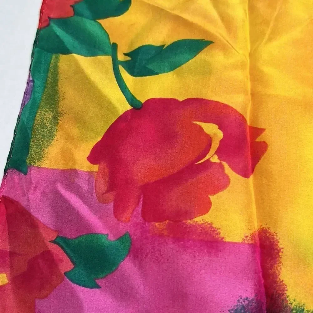 Vibrant floral silk scarf with gold purple pink and red flowers.